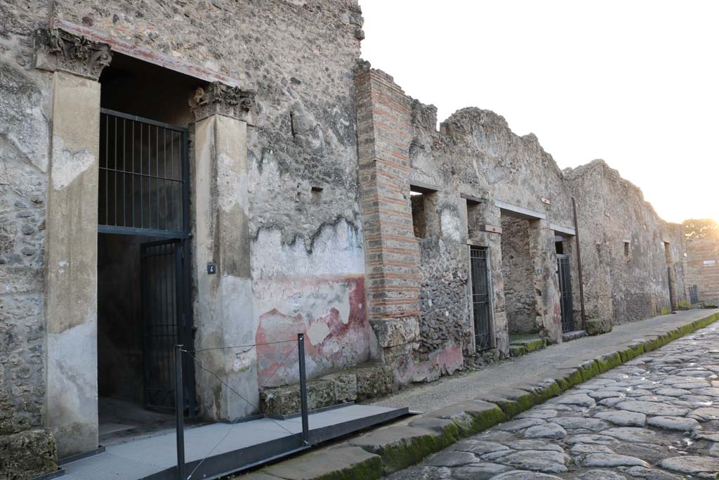 1.10.4 Pompeii, on left. December 2018.
Looking south-west along north side of insula, towards doorways between I.10.4 and I.10.8. Photo courtesy of Aude Durand.