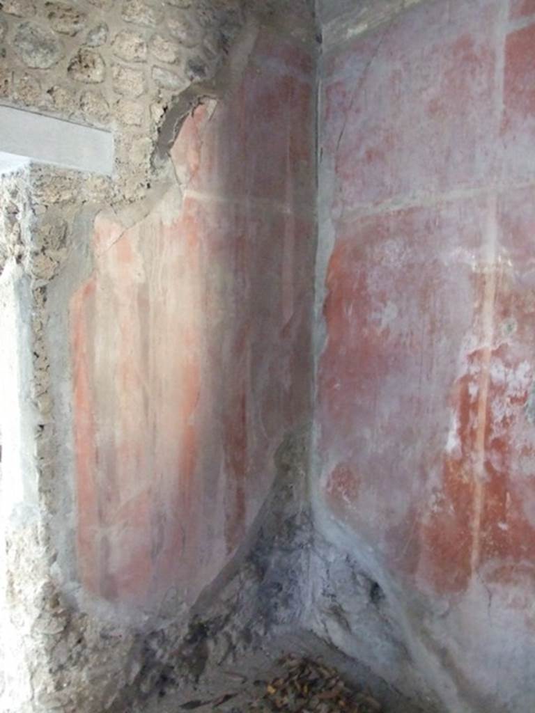 I.10.7 Pompeii. March 2009. Room 8.  Painted decoration in south west corner. 