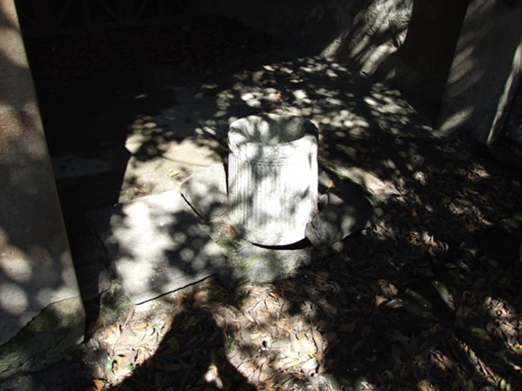 I.10.7 Pompeii. March 2009. Room 10.  North portico.  The puteal of the cistern at the east end.