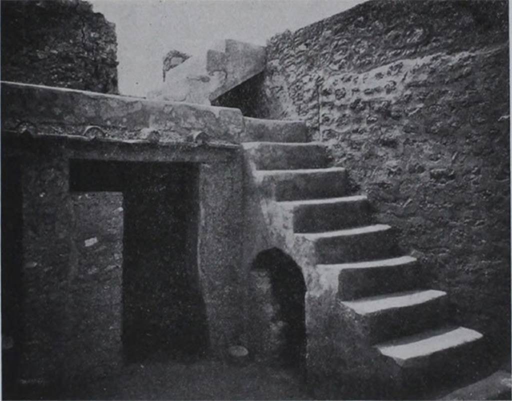 I.10.8 Pompeii. Room 5, south-west corner of the yard, with stairs to upper gallery and cupboard under, and doorway to small room.
These masonry steps against the west wall, were covered with a coating of cocciopesto, and consisted of 9 steps leading to a gallery on which opened a room on the upper floor to the east.  From this then, by another four steps, one arrived at the western rooms of the upper floor.

Al lato occidentale una scalinata di fabbrica, rivestita di intonaco di cocciopesto, di nove gradini che porta ad un ballatoio, sul quale si apre un ambiente del piano superiore ad est.  Da questo poi per altri quattro scalini, si accede al quartierino ovest del piano superiore.

See Notizie degli Scavi di Antichit�, 1934, p. 311, fig. 24.
