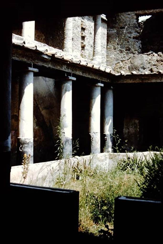 I.10.11 Pompeii. 1959. Room 10, peristyle. Looking north-east to lower and upper floors of portico. Photo by Stanley A. Jashemski.
Source: The Wilhelmina and Stanley A. Jashemski archive in the University of Maryland Library, Special Collections (See collection page) and made available under the Creative Commons Attribution-Non Commercial License v.4. See Licence and use details.
J59f0127
