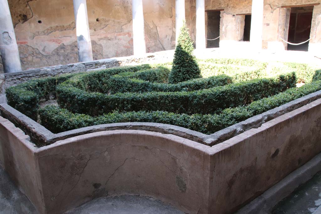 I.10.11 Pompeii. September 2021. Room 10, looking east across peristyle garden, from south-west corner. Photo courtesy of Klaus Heese.