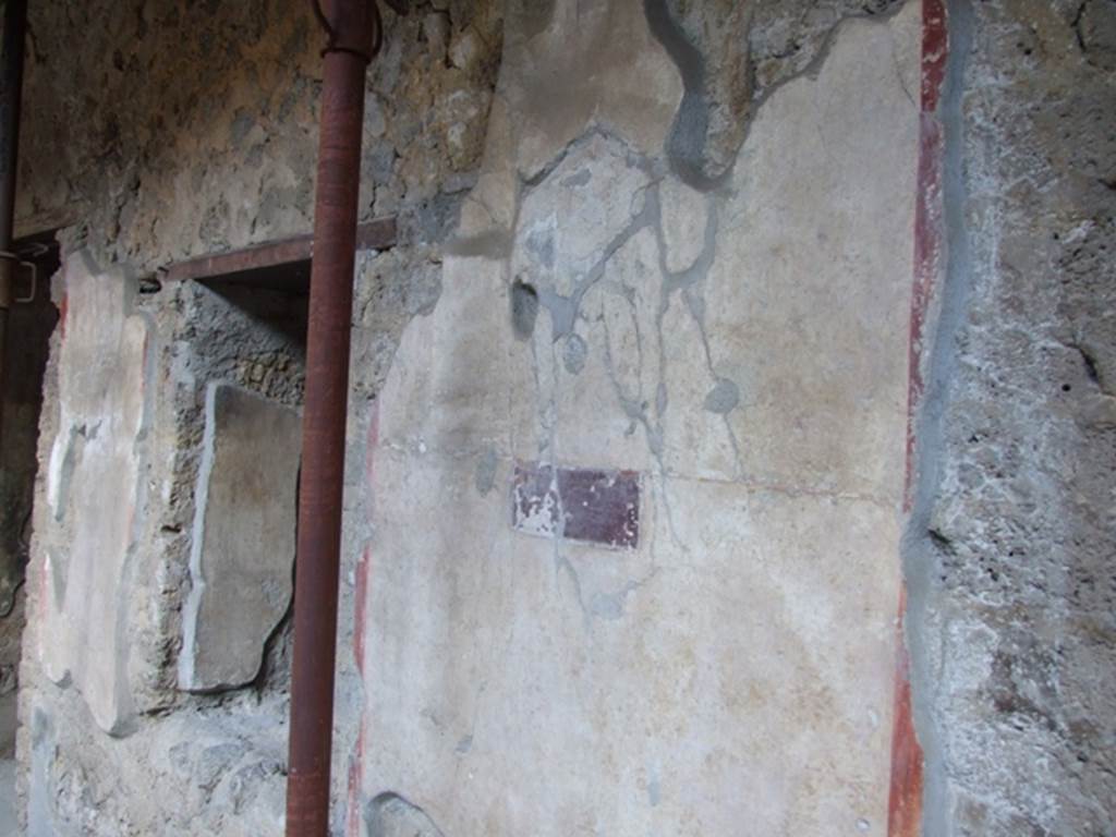 I.10.11 Pompeii. March 2009. Room 10, east wall of peristyle, between doorways to room 11 and room 12.  According to PPP, there was graffiti on this wall, perhaps on the “violet” panel, perhaps near a painted garland?  The one near the painted garland was on a white background and identified as CIL IV 8404b See Bragantini, de Vos, Badoni, 1981. Pitture e Pavimenti di Pompei, Parte 1. Rome: ICCD. (p.144)
According to Epigraphik-Datenbank Clauss/Slaby (See www.manfredclauss.de), it read as -
Ur{u}sa     [CIL IV 8404b]


