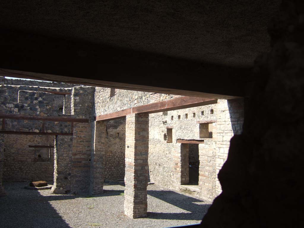 I.10.14 Pompeii. September 2005. Looking north-west across stable from blocked entrance doorway.
