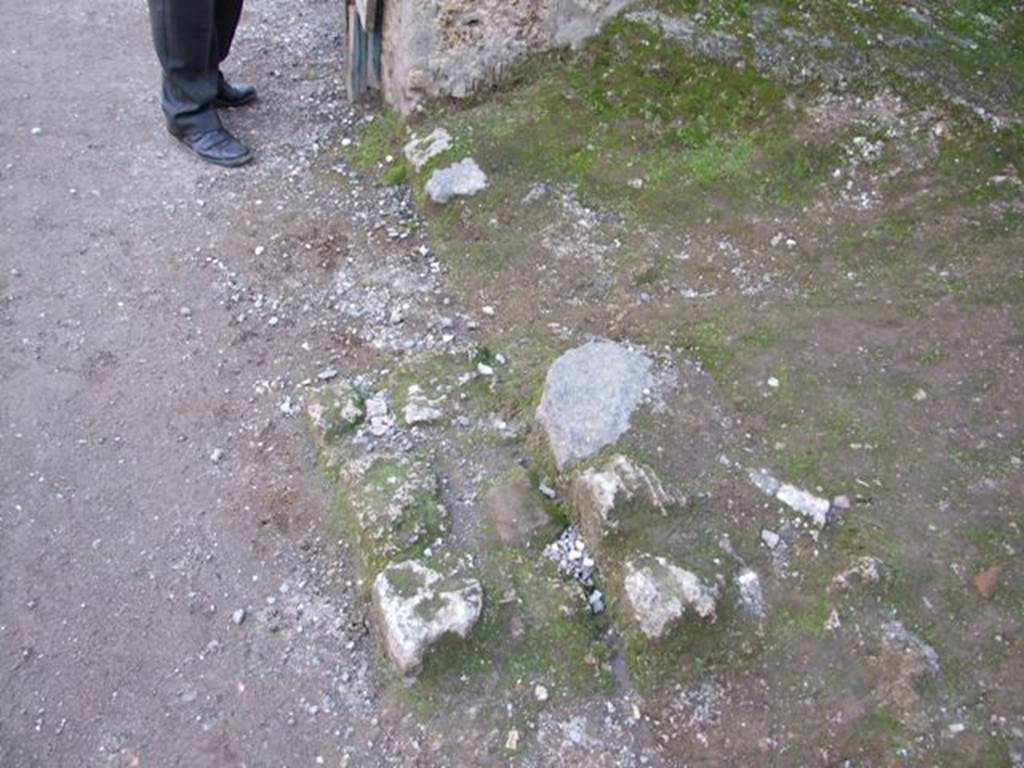I.11.4 Pompeii. December 2007. Front of shop floor and remains of step?