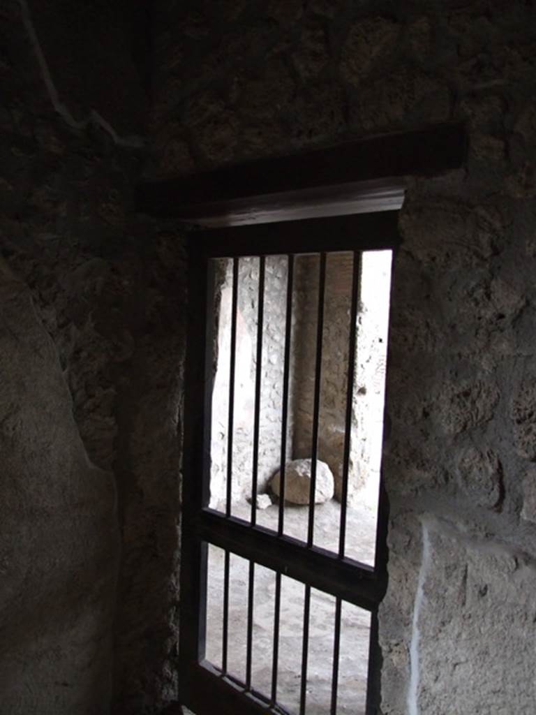 I.11.6 Pompeii. March 2009. Room 2.   North wall with door to shop at I.11.7