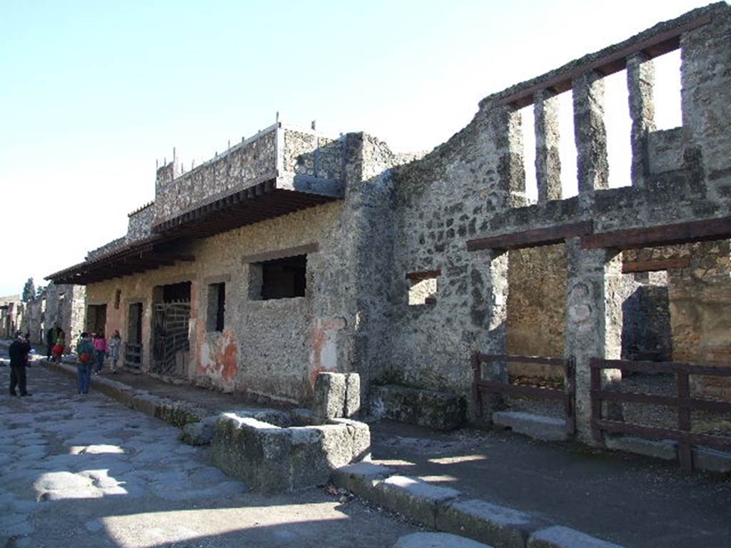 I.12.1 and I.12.2 Pompeii.  December 2006. Entrances on Via dell�Abbondanza. Looking east.