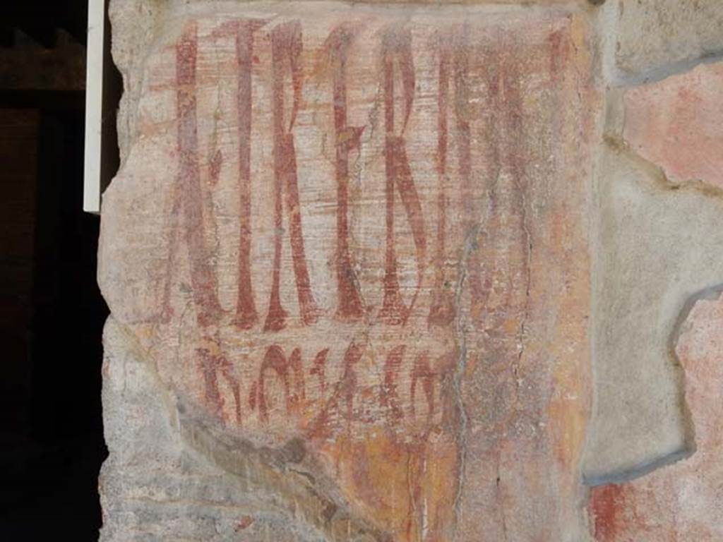 I.12.3 Pompeii, May 2018. Detail of graffiti on the west side of the doorway. Photo courtesy of Buzz Ferebee.

