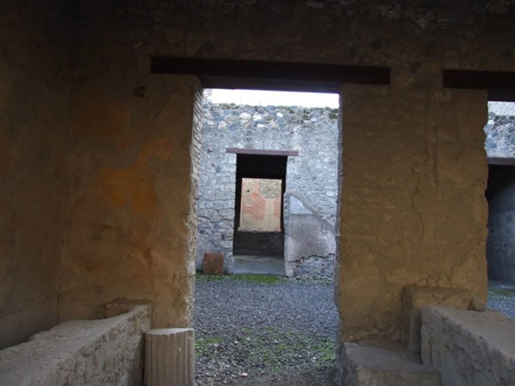 I.12.5 Pompeii. December 2007. Looking south through rear of caupona across atrium to the triclinium with window.