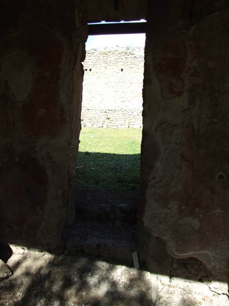 I.12.8 Pompeii. March 2009. Room 9. Doorway with three steps in north wall to rear garden.