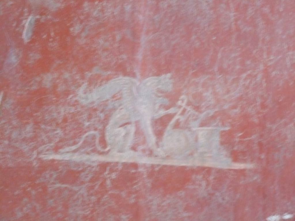I.12.11 Pompeii. December 2007. 
Painted panel of attributes of Apollo (Griffin and lyre leaning against an altar) from east end of south wall of triclinium. 
