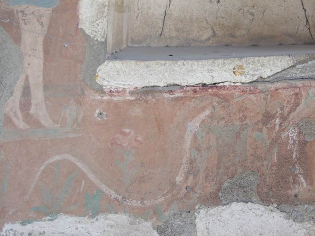 I.12.15 Pompeii. March 2009. Room 5, north end beneath the niche, painted altar with painted flowers, and white serpent.