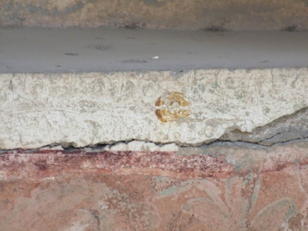 I.12.15 Pompeii. March 2009. Room 5, painted plants beneath the lararium niche.