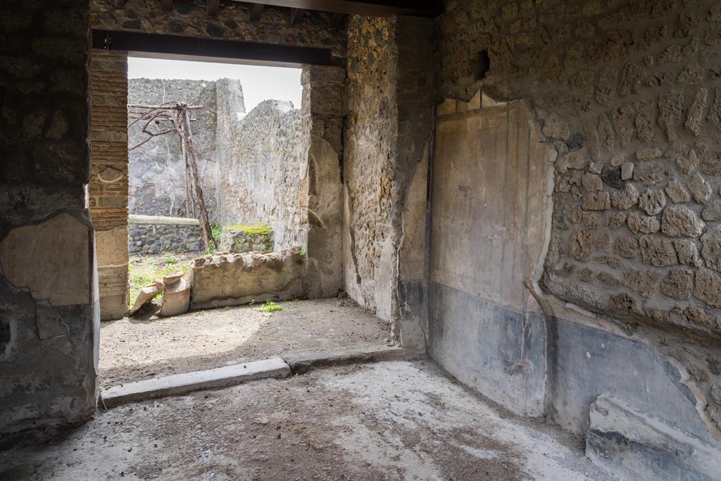 I.13.2 Pompeii. March 2023. Looking south across triclinium towards garden area. Photo courtesy of Johannes Eber.