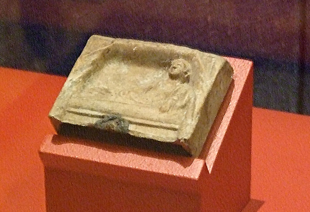 I.13.3 Pompeii. Terracotta relief of a reclining deity. SAP 11549. 
Photographed at �A Day in Pompeii� exhibition at Melbourne Museum. September 2009.
