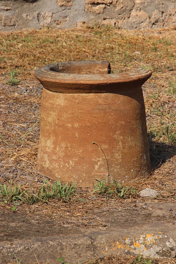 I.13.12 Pompeii. October 2023. 
Terracotta puteal on north side of impluvium in atrium. Photo courtesy of Klaus Heese.
