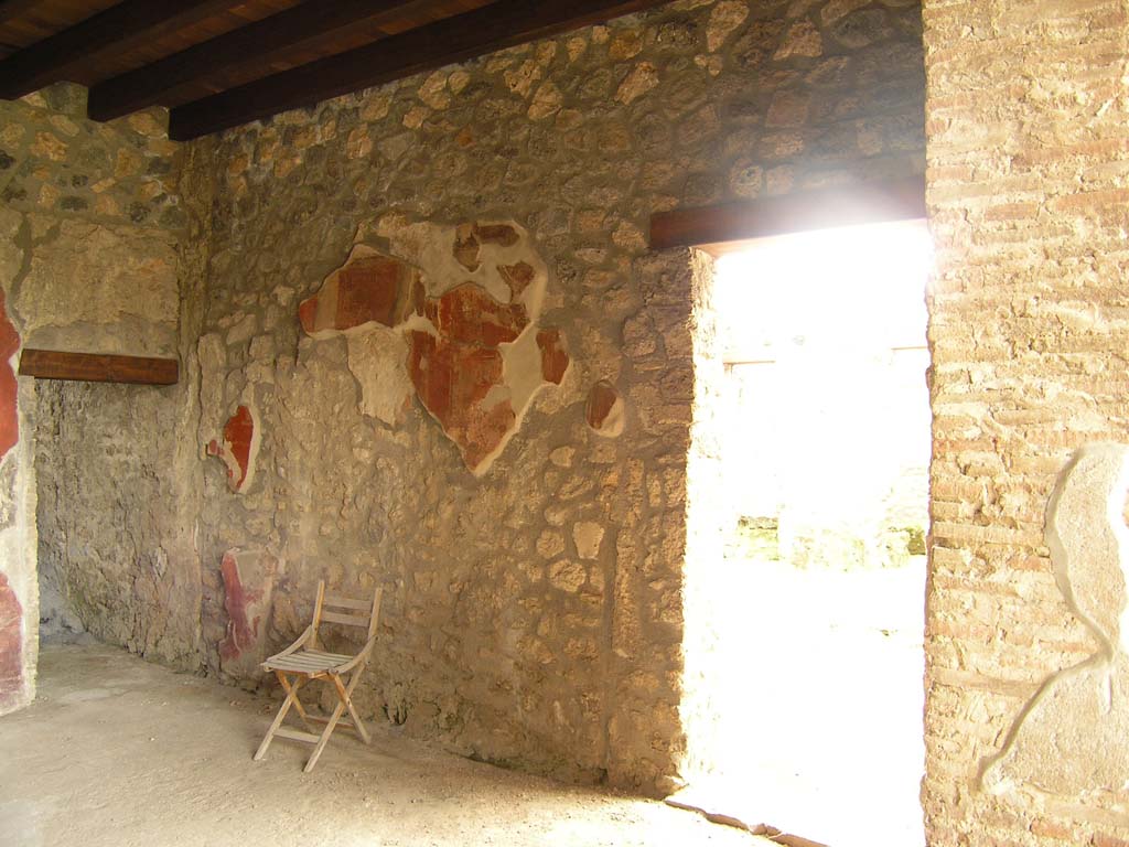 I.14.2 Pompeii. July 2008. Room H, south wall.
The doorway on the left is to room I, the doorway on the right leads to the atrium.
Photo courtesy of Guilhem Chapelin.