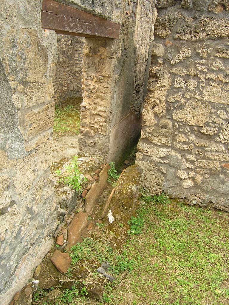 I.14.2 Pompeii. July 2008. Drain in south-east corner of Garden area M, looking south.
Photo courtesy of Guilhem Chapelin. 
