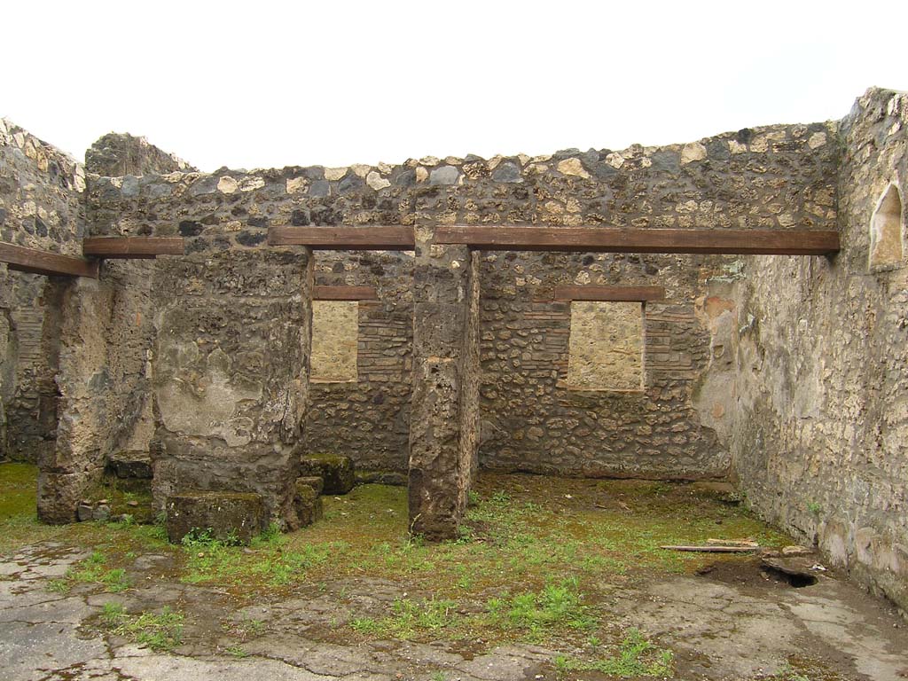 I.14.2 Pompeii. July 2008. Room B, looking south across atrium.
On the left is the doorway to room D, followed by stairs to upper floor.
In the centre is the doorway to room E, with room F, on the right.
Photo courtesy of Guilhem Chapelin. 
