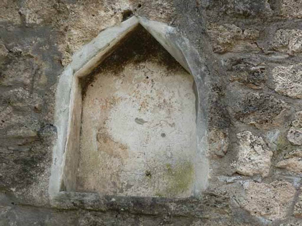 I.14.2 Pompeii. May 2010. Lararium with traces of red garlands on a white background on west wall of atrium.
Voir Chapitre 2 : L�atelier de fabrication de nattes de la via di Nocera (I 14, 2) in Magali Cullin-Mingaud, 2010. La vannerie dans l'Antiquit� romaine: Collection du Centre Jean B�rard 35. Paris. Centre Jean Berard, p. 129-171, fig. 149.
https://books.openedition.org/pcjb/706
