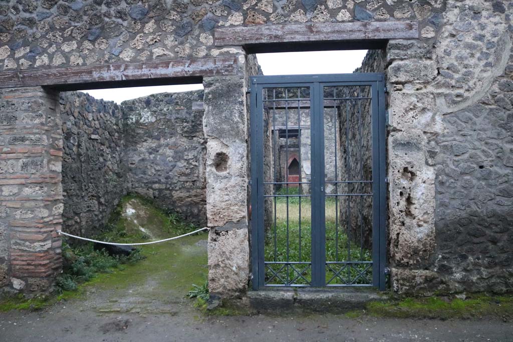 I.14.7 Pompeii, on right. December 2018. Looking south to entrance doorways, with I.14.6, on left. Photo courtesy of Aude Durand.