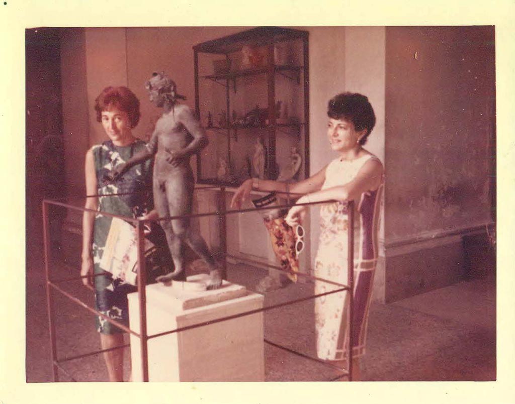 I.16.2 Pompeii. July 1964. Bronze statue of Bacchus in VIII.1.4, Pompeii Antiquarium. 
Height 0.96m, width 0.37m. SAP inventory number 11864. Photo courtesy of Rick Bauer.
The statue of Bacchus has, by various authors, been attributed to I.18.2, I.17.2, I.16.2 and I.15.2.

2009: For the Day in Pompeii Melbourne exhibition, SANP said the statuette was found in I.16.2.
1990: In Rediscovering Pompeii, IBM catalogue the statuette was attributed to I.18.2.
1993: Liselotte Eschebach attributed it to I.15.2. 
1961: Olga Elia attributed it to I.17.2.

According to Stefani and Borgongino (2010), it was definitely found in I.XVIII.2 now I.16.2. 
Using the photographs and papers from the time of the find but newly found “nel riordinare la documentazione dell’ Archivio Fotografico della Soprintendenza….” to identify the locations and cross-referencing them with the inventories and excavation documentation, they concluded that they were found in I.XVIII (now I.16) but that this had been entered in the inventory books as I.XVII through a mistake in interpreting the roman numerals. There had also been some confusion over doorways and room numbers.
On page 93 the statue of Bacchus is mentioned as “statua rinvenuta certamente in I.XVIII.2” ….. “attuale I.16.2”
See Rivista di Studi Pompeiani XXI, 2010, pp. 87-99 but specifically p. 93, by Grete Stefani and Michele Borgongino.
See Eschebach, L., 1993. Gebäudeverzeichnis und Stadtplan der antiken Stadt Pompeji. Köln: Böhlau.
See Elia O., 1961. Bacco Fanciullo e Dioniso chtonio a Pompeii: Bolletino d'Arte serie 4, pp. 1-6.
See Rediscovering Pompeii, IBM catalogue, 1990-92, no.187, p.266-7.

