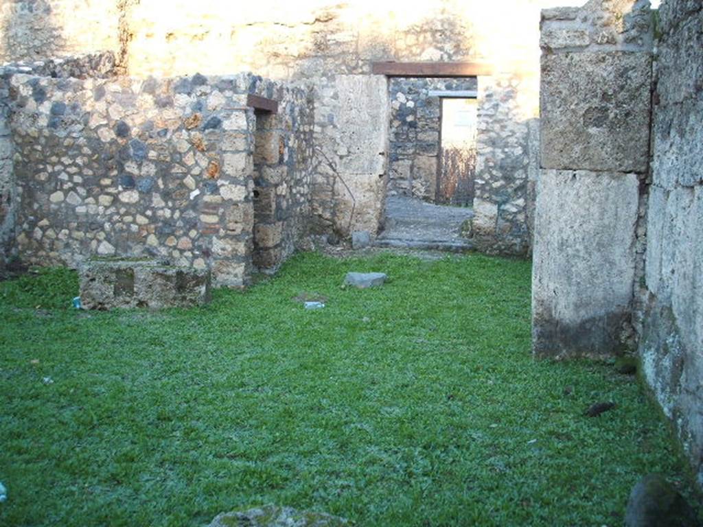 I.16.7 Pompeii. December 2006. Looking east across yard towards entrance doorway.