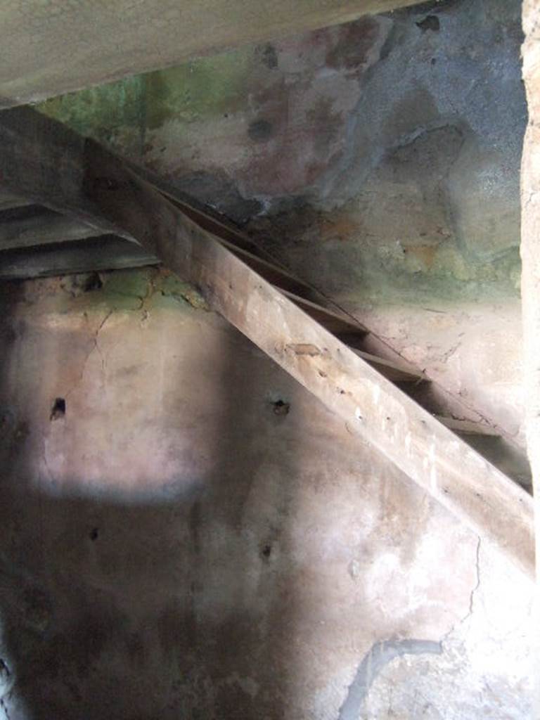 I.17.4 Pompeii. May 2006. Open area or yard on south side of peristyle garden. Reconstructed stairs against south wall.