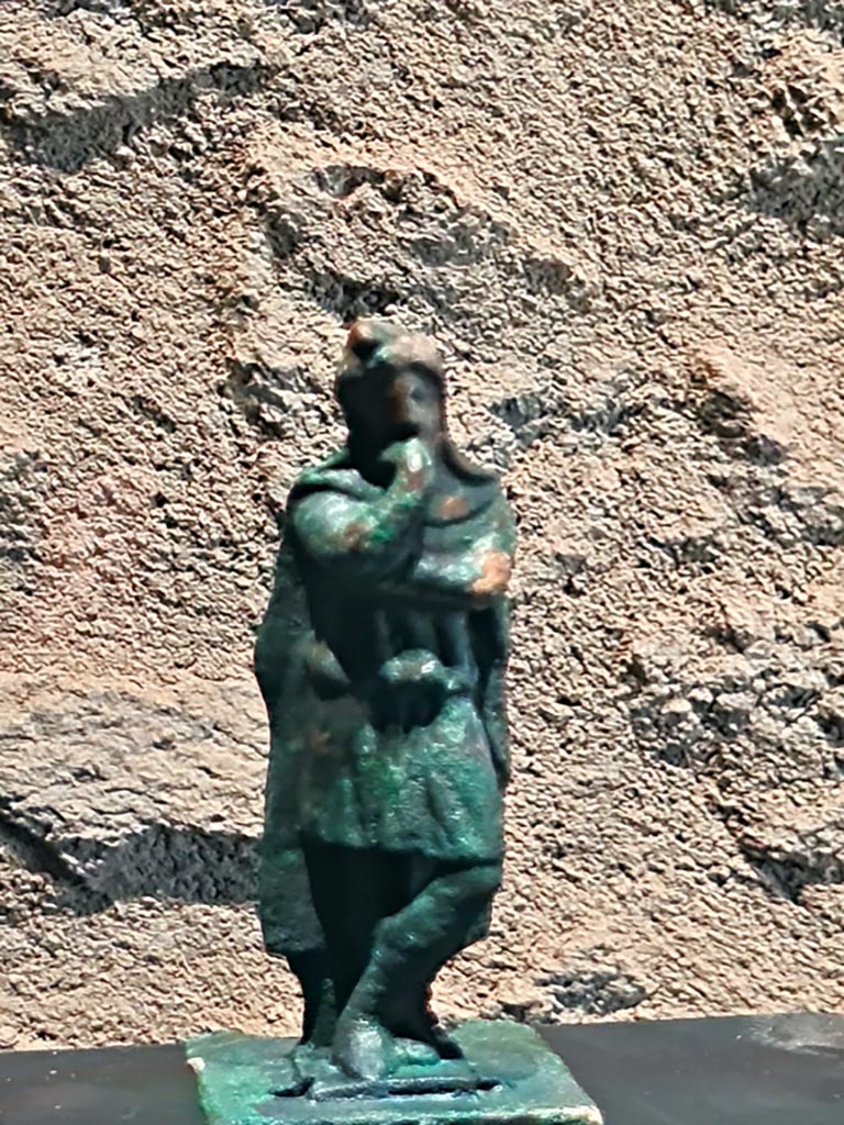 II.1.3 Pompeii. March 2024. Photo courtesy of Giuseppe Ciaramella.
Bronze statuette of Attis (Ist century AD). (Statuetta di Attis, Bronzo, I sec. d.C).
On display in exhibition in Palaestra entitled – “L’altra Pompei, vite comuni all’ombra del Vesuvio”.

