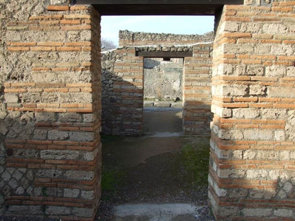 II.1.4 Pompeii.   December 2007.  Looking north across middle room to entrance room on Via dell� Abbondanza.
