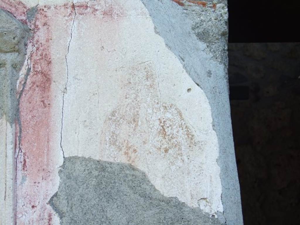 II.1.9 Pompeii.  March 2009.  Remains of painting of Hercules, on south side of niche, in red-bordered panel.