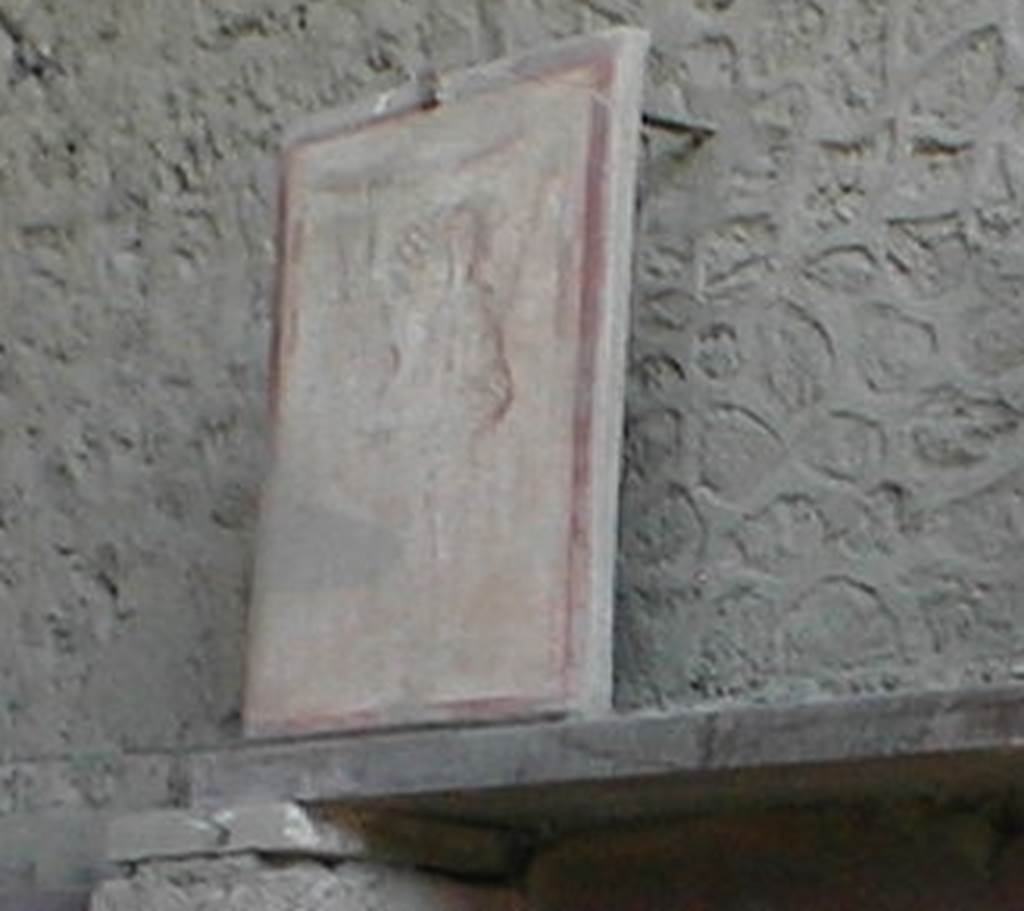 II.1.12 Pompeii. May 2005. 
Pilaster painting from south side of entrance fa�ade, painting of Bacchus and Mercury. Currently (May 2005) in III.3.6. 
See Fr�hlich, T., 1991, Lararien und Fassadenbilder in den Vesuvst�dten. Mainz: von Zabern. (F16:p.312, T. 54/1).
Following the collapse of III.3.6 in November 2010, this may have been destroyed.


