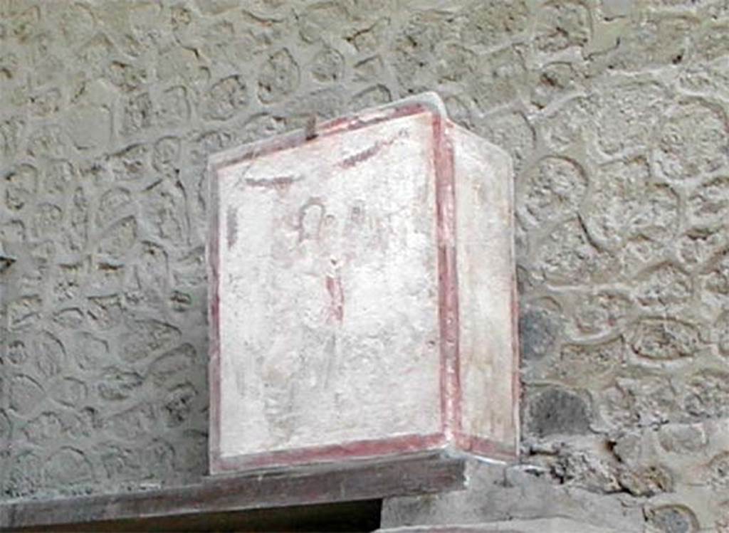 II.1.12 Pompeii. May 2005. Pilaster painting from north side of entrance fa�ade.
Painting of Venus Anadyomene (Venus rising from the sea) with a small naked Eros and a jumping dolphin. This was in III.3.6. 
See Fr�hlich, T., 1991, Lararien und Fassadenbilder in den Vesuvst�dten. Mainz: von Zabern. (F16: p.312, T. 54/2).
Following the collapse of III.3.6 in November 2010, this is believed to have been destroyed. 
