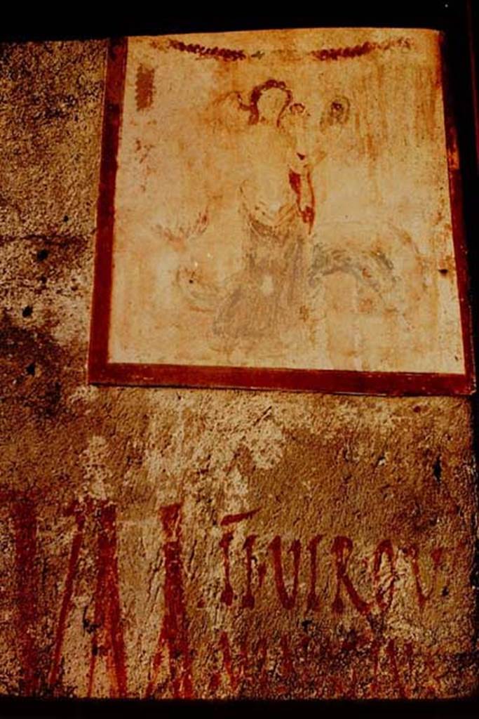 II.1.12 Pompeii, 1968. Pilaster on north side of entrance fa�ade, painting of Venus with graffiti below it.
Venus Anadyomene (Venus rising from the sea) with a small naked Eros and a jumping dolphin.
Photo by Stanley A. Jashemski.
Source: The Wilhelmina and Stanley A. Jashemski archive in the University of Maryland Library, Special Collections (See collection page) and made available under the Creative Commons Attribution-Non Commercial License v.4. See Licence and use details.
J68f0269
