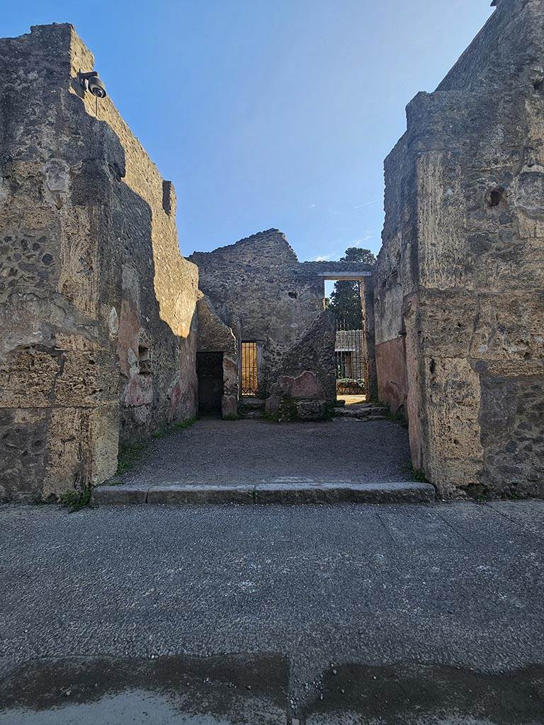 II.2.3 Pompeii. November 2024. 
Looking south on Via dell’Abbondanza towards entrance doorway. Photo courtesy of Annette Haug.
