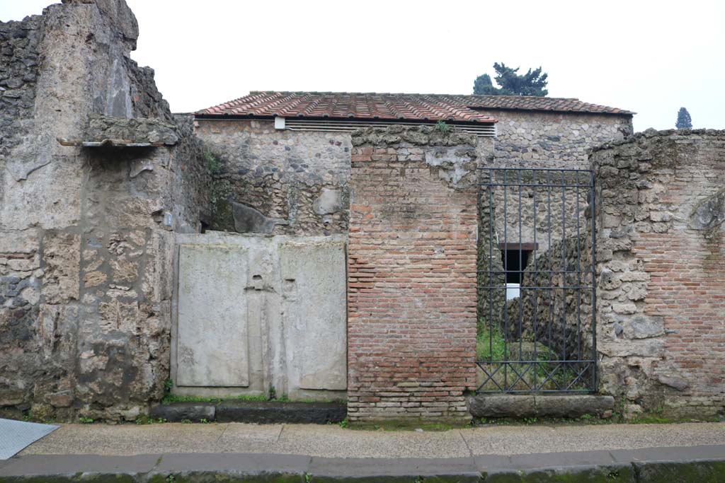 II.3.2, Pompeii, on left. December 2018. Entrance doorways on south side of Via dell�Abbondanza. Photo courtesy of Aude Durand.