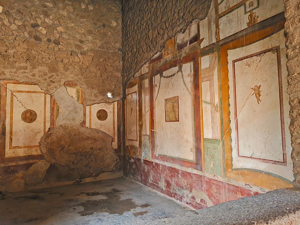 II.3.3 Pompeii. March 2024.
Room 4, looking towards east wall, south-east corner, and south wall of cubiculum. Photo courtesy of Giuseppe Ciaramella.