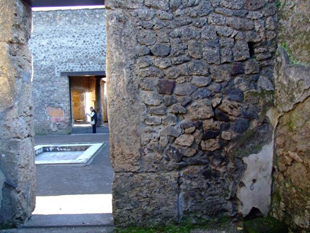 II.3.3 Pompeii.  March 2009.  Room 7,  South wall, with doorway to Room 2, Atrium.
