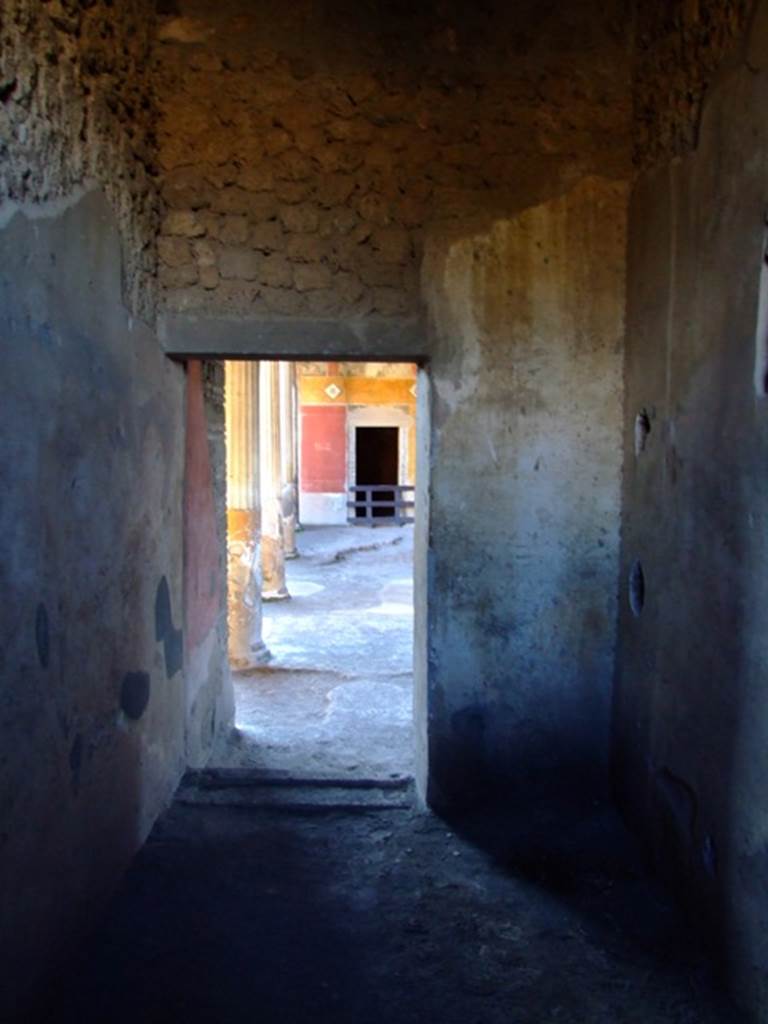 II.3.3 Pompeii.  March 2009.  Room 8, West wall, and doorway to Room 11, Portico.