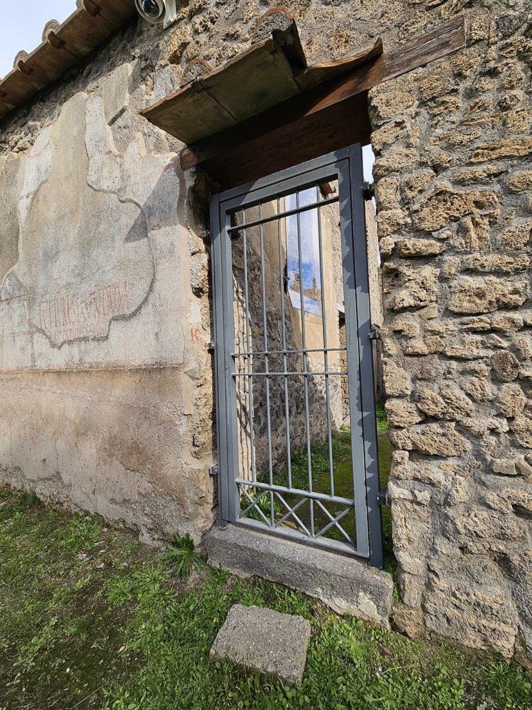 II.4.10 Pompeii. November 2024. 
Entrance doorway on south side of painted inscriptions. Photo courtesy of Annette Haug.
