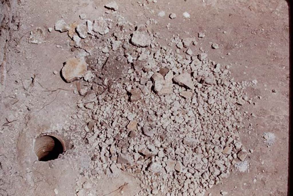 II.5 Pompeii, 1968.  A buried amphora built into the couch of the triclinium. Photo by Stanley A. Jashemski.
Source: The Wilhelmina and Stanley A. Jashemski archive in the University of Maryland Library, Special Collections (See collection page) and made available under the Creative Commons Attribution-Non Commercial License v.4. See Licence and use details.
J68f0906
