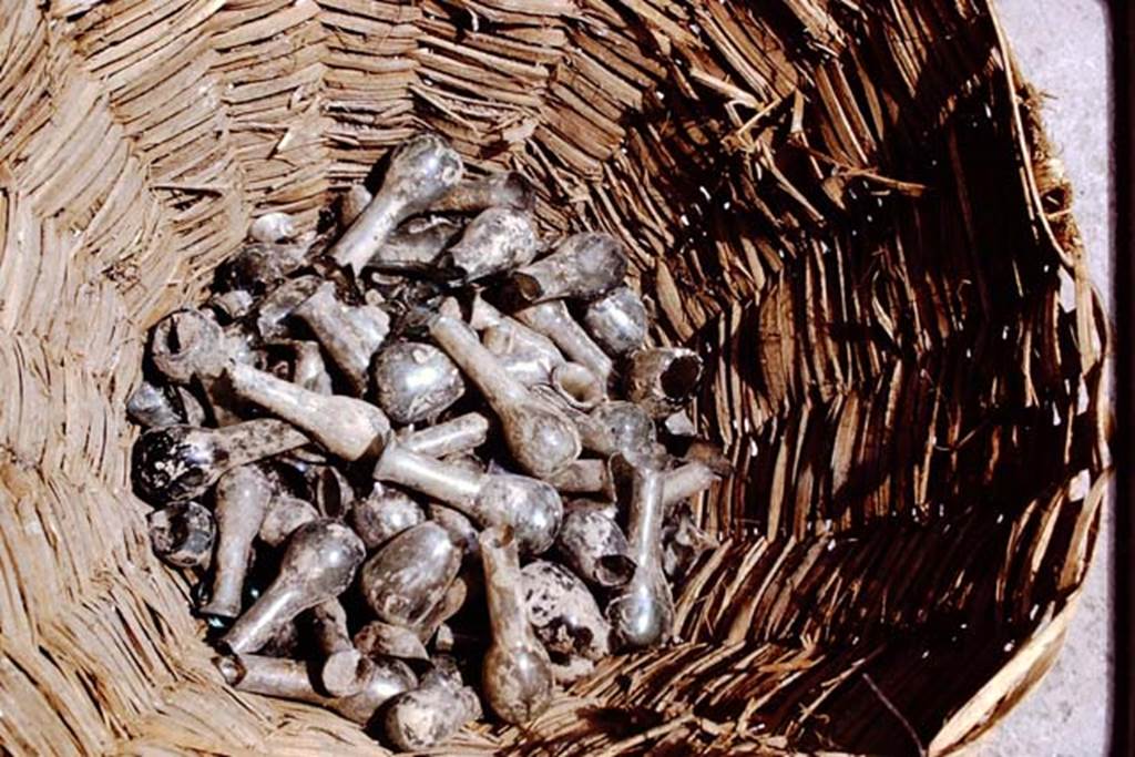 II.8.6 Pompeii. 1972. Detail of small glass perfume bottles. Photo by Stanley A. Jashemski. 
Source: The Wilhelmina and Stanley A. Jashemski archive in the University of Maryland Library, Special Collections (See collection page) and made available under the Creative Commons Attribution-Non Commercial License v.4. See Licence and use details. J72f0321
