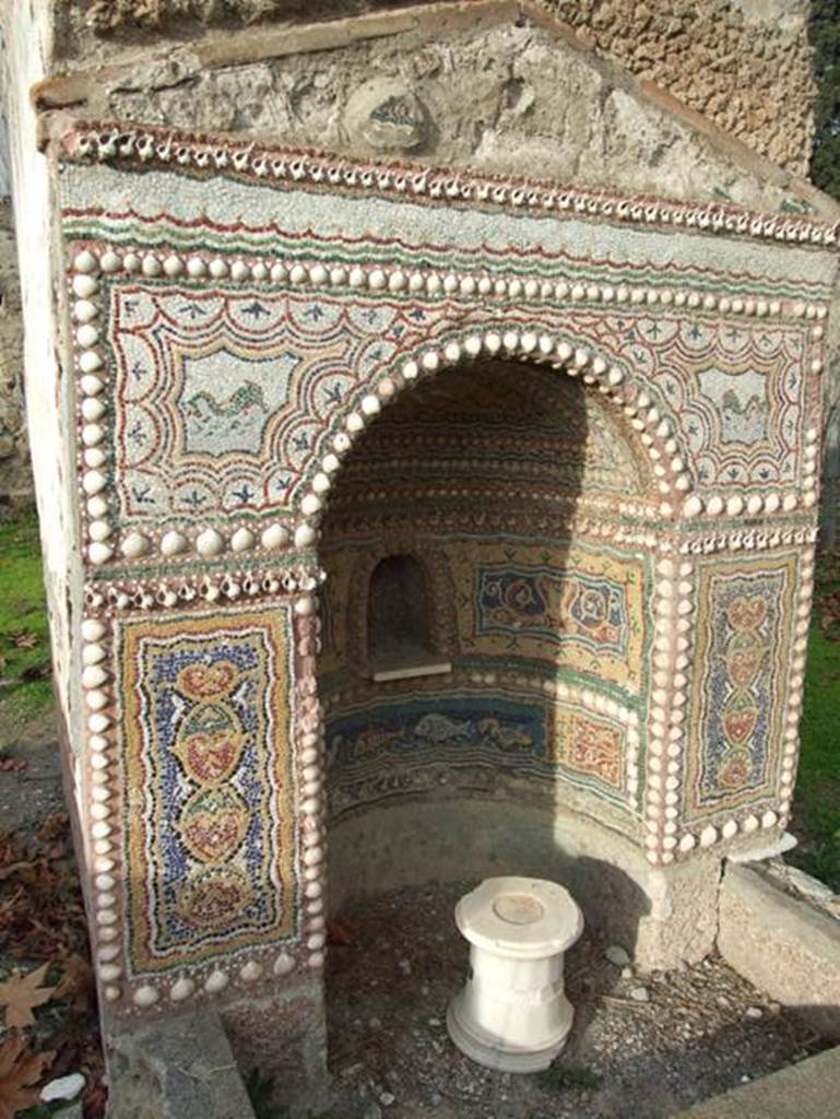 II.9.7. Garden entrance to House of Summer Triclinium.  December 2007.  Fountain or Nymphaeum on the north side.  South face.  Mosaic.