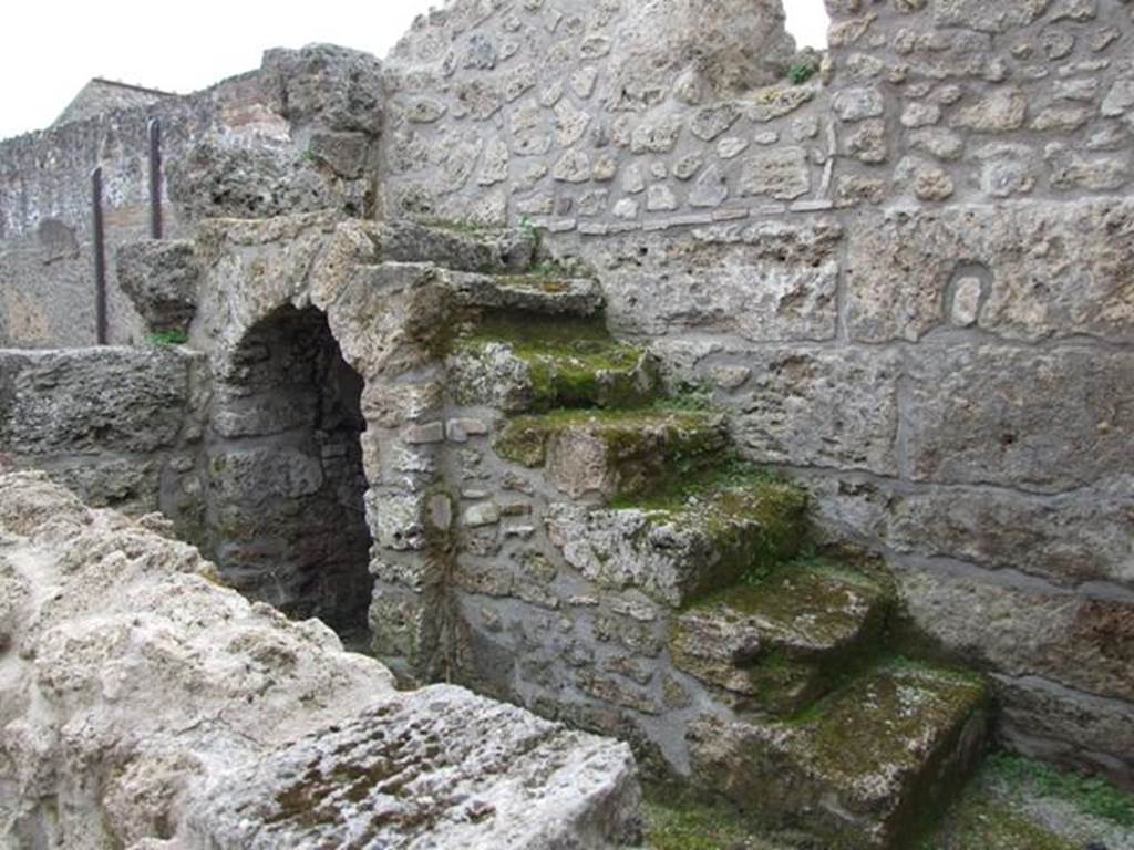 III.2.1 Pompeii.  March 2009.  Room 3.  Steps to upper floor, with cupboard underneath.