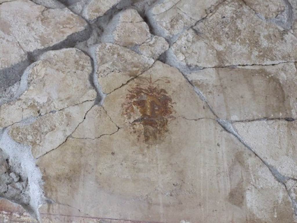 III.2.1 Pompeii.  March 2009.  Room 9.  Tablinum.  West wall Upper Section.  North end.  Painted face or mask.