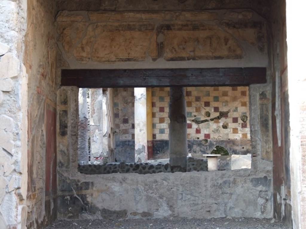 III.2.1 Pompeii.  December 2007.  Tablinum.  North wall with window to peristyle, and two wall paintings above window.