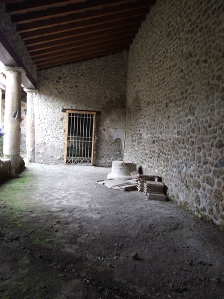 III.2.1 Pompeii.  March 2009.  Looking north along east portico to doorway of room 14.