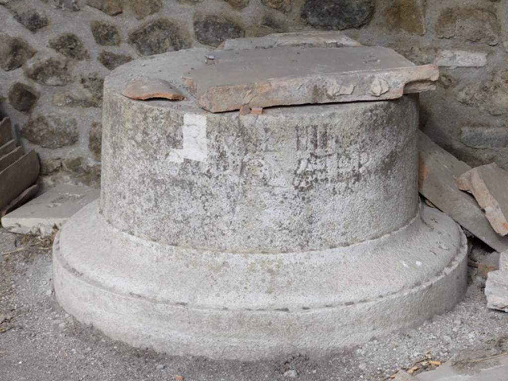 III.2.1 Pompeii.  March 2009.  East portico.  Marble base of column.  When excavated this was found upside down against the wall of the east ambulatory.  The base, reportedly for an honorary statue, is inscribed  “TR MIL IIII DUOVIR QUATER”.  See Della Corte, M., 1965.  Case ed Abitanti di Pompei. Napoli: Fausto Fiorentino. (p.346).