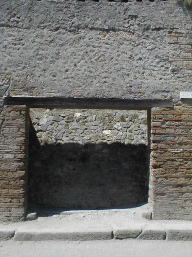 III.2.3 Pompeii. May 2005. Entrance doorway, partly excavated.
According to Varone and Stefani, found on the right pilaster was �
L(ucium)  Ceium  IIvir(um)  i(ure)  d(icundo)     [CIL IV 9931a]
This is no longer visible, but a small amount of white on the brickwork marks the spot. See Varone, A. and Stefani, G., 2009. Titulorum Pictorum Pompeianorum, Rome: L�erma di Bretschneider, (p.241)
According to Della Corte, to the right of the entrance was found �
Priscum  aed(ilem)  
o(ro)  v(os)  f(aciatis)  Lutati   fac(iunt)    [CIL IV 7636]
See Della Corte, M., 1965.  Case ed Abitanti di Pompei. Napoli: Fausto Fiorentino. (p.349)
