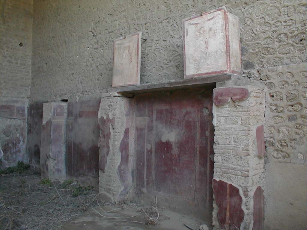 III.3.6 Pompeii. May 2005. East wall. The two paintings, at the top, on the shelf, were from the façade of II.1.12.